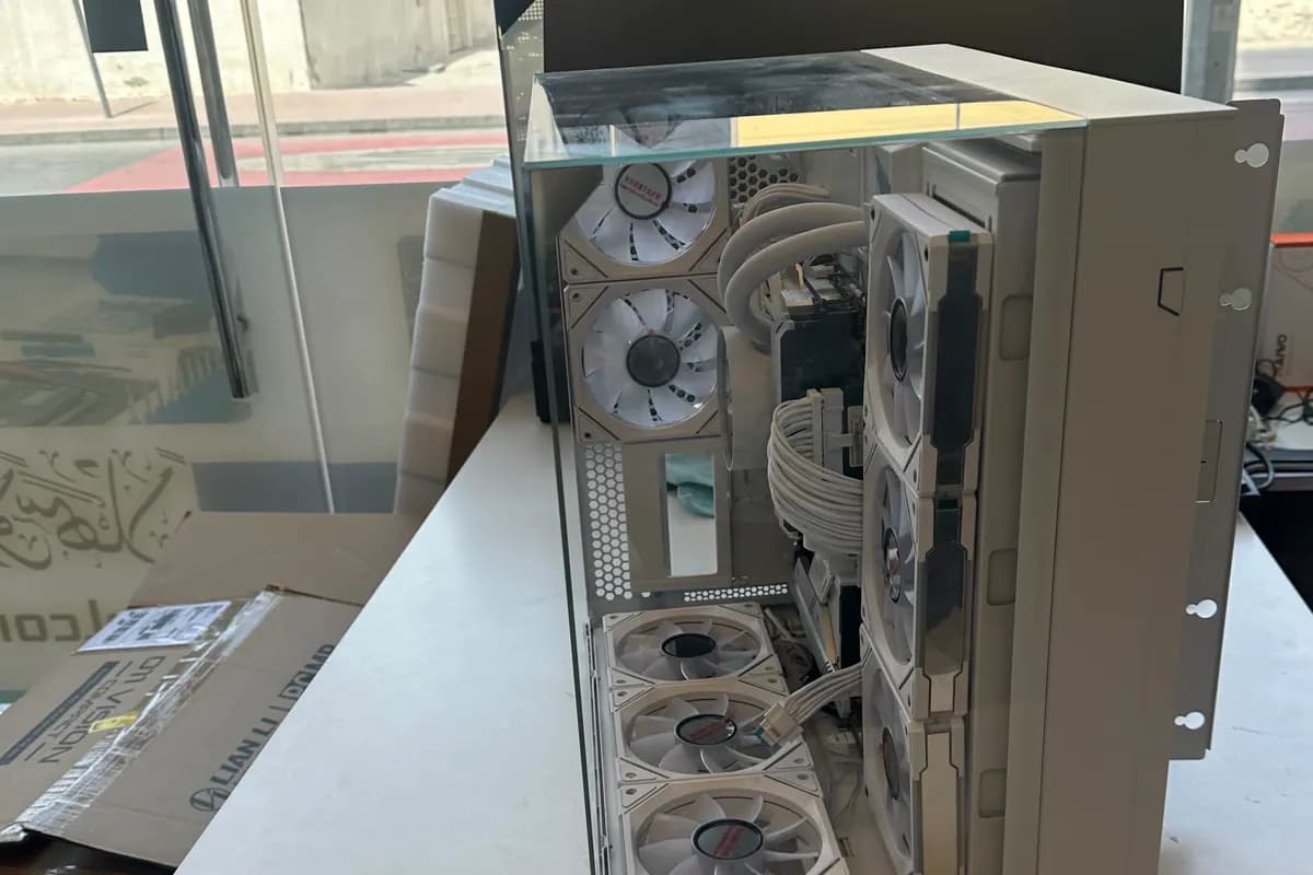White custom desktop PC build prepared by WEFIX-IT in Dubai with cooling fans and internal cabling visible